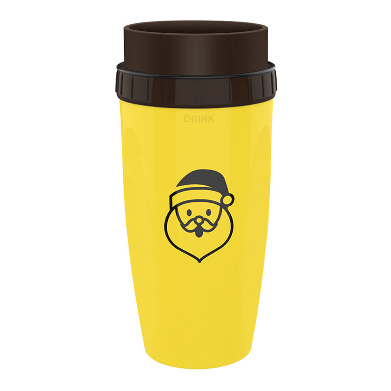 Stylishly yellow Coffee Straw Twistable Cup, having a Santa's head and a shade of brown around it's top with built-in twistable straw for convenient, sustainable sipping on-the-go